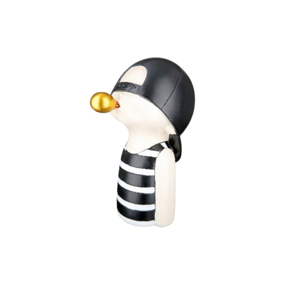 Gilde resin figure of a boy chewing gum, black and white, 25cm tall, detailed sculpture with realistic features.