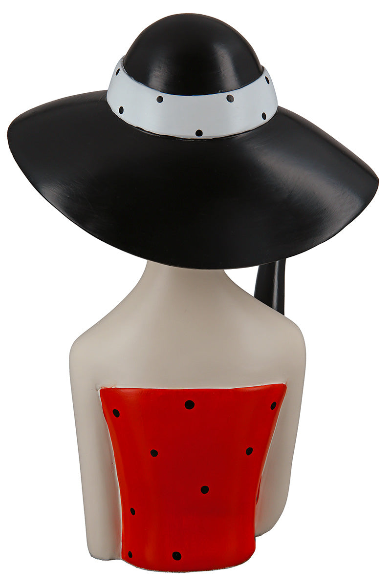 Gilde woman figure wearing a black hat with dotted details, detailed figurine of a lady with elegant attire