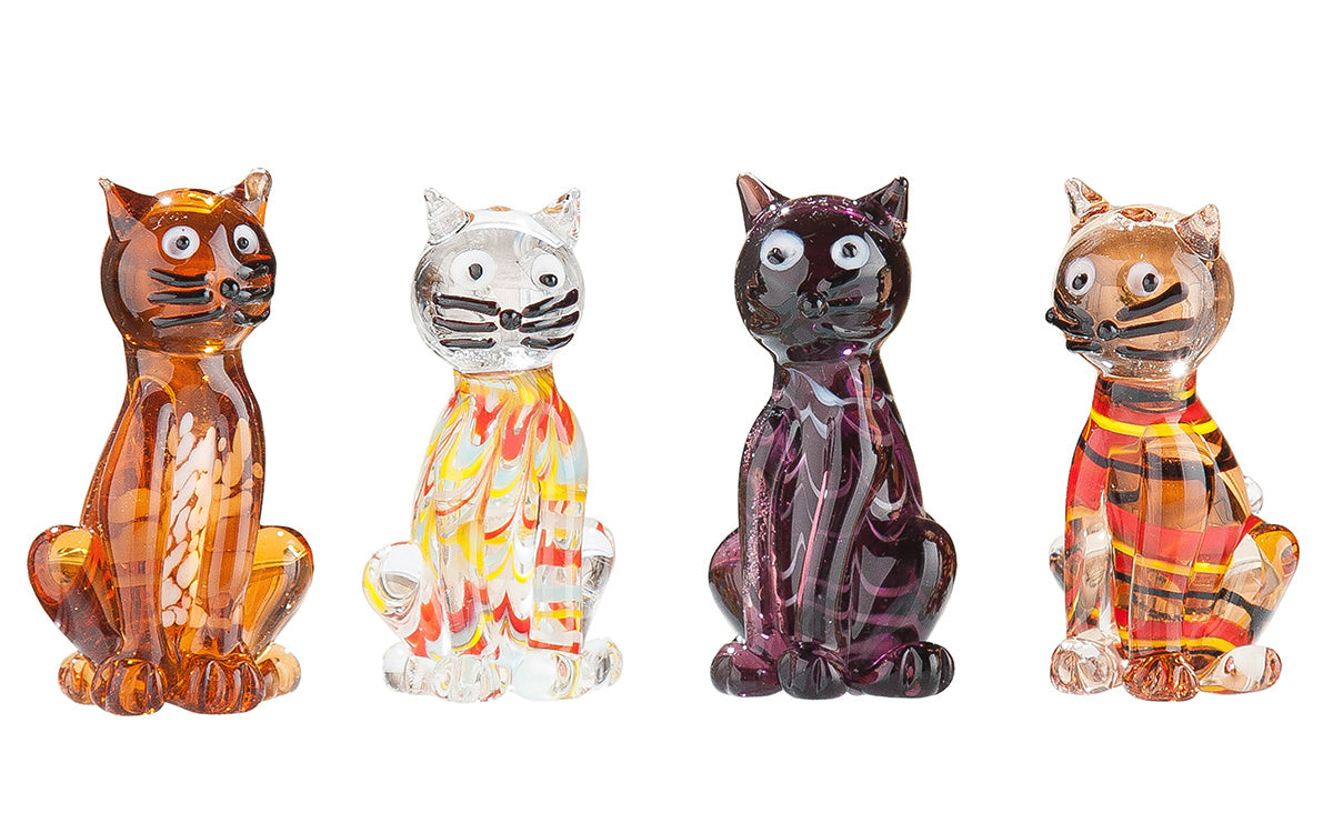 Small purple cat figurine by Gilde, Lou Glass collectible sculpture with detailed features and vibrant purple color.