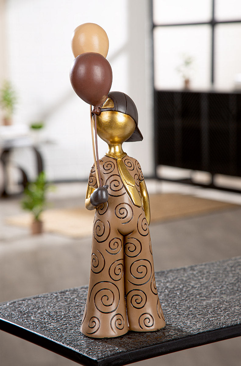 Gilde Boy Balloon figure with brown ball motif, featuring a child design, suitable for decoration or celebration displays.
