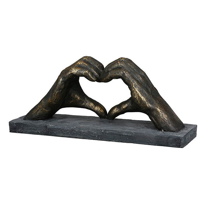 Gilde bronze sculpture featuring a heart-shaped hand motif, showcasing detailed craftsmanship and artistic design.