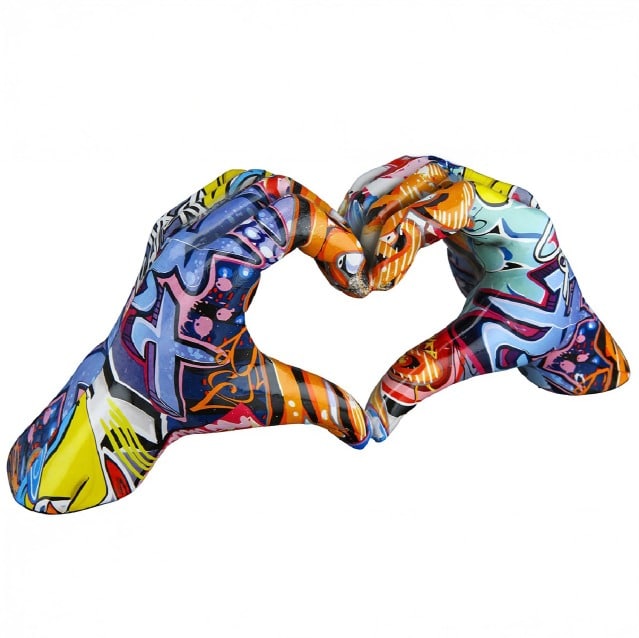 Multicolored Gilde Heart Hand Motif graffiti art on paper featuring vibrant, expressive writing and artistic design.