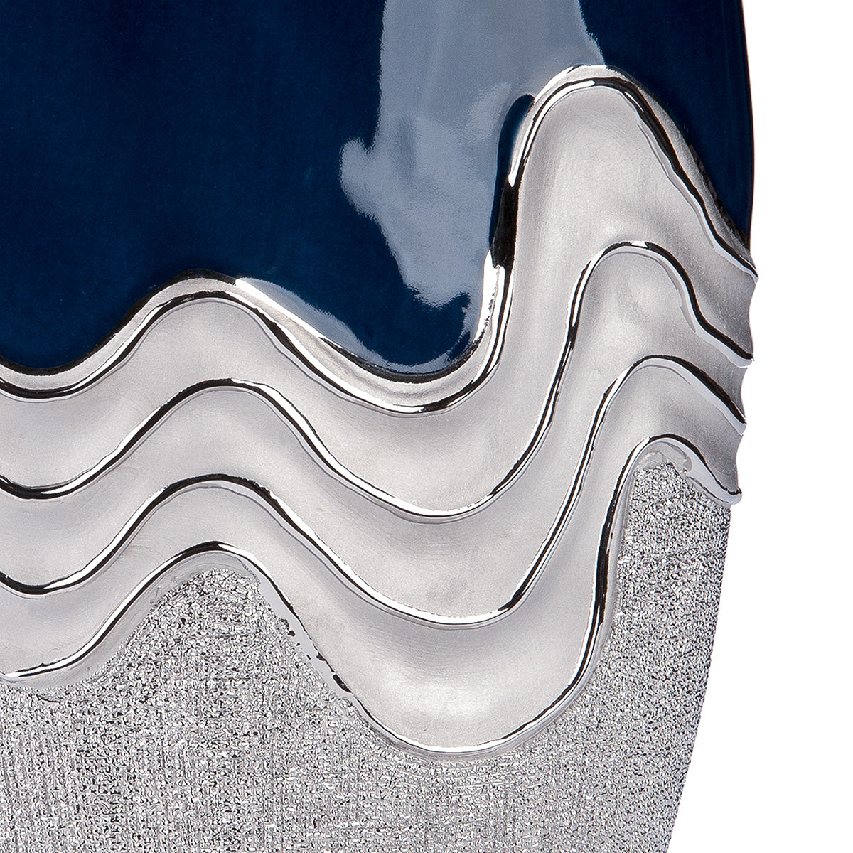 Dark blue Gilde conical vase with wavy ceramic design and silver accents, showcasing its elegant, modern shape.
