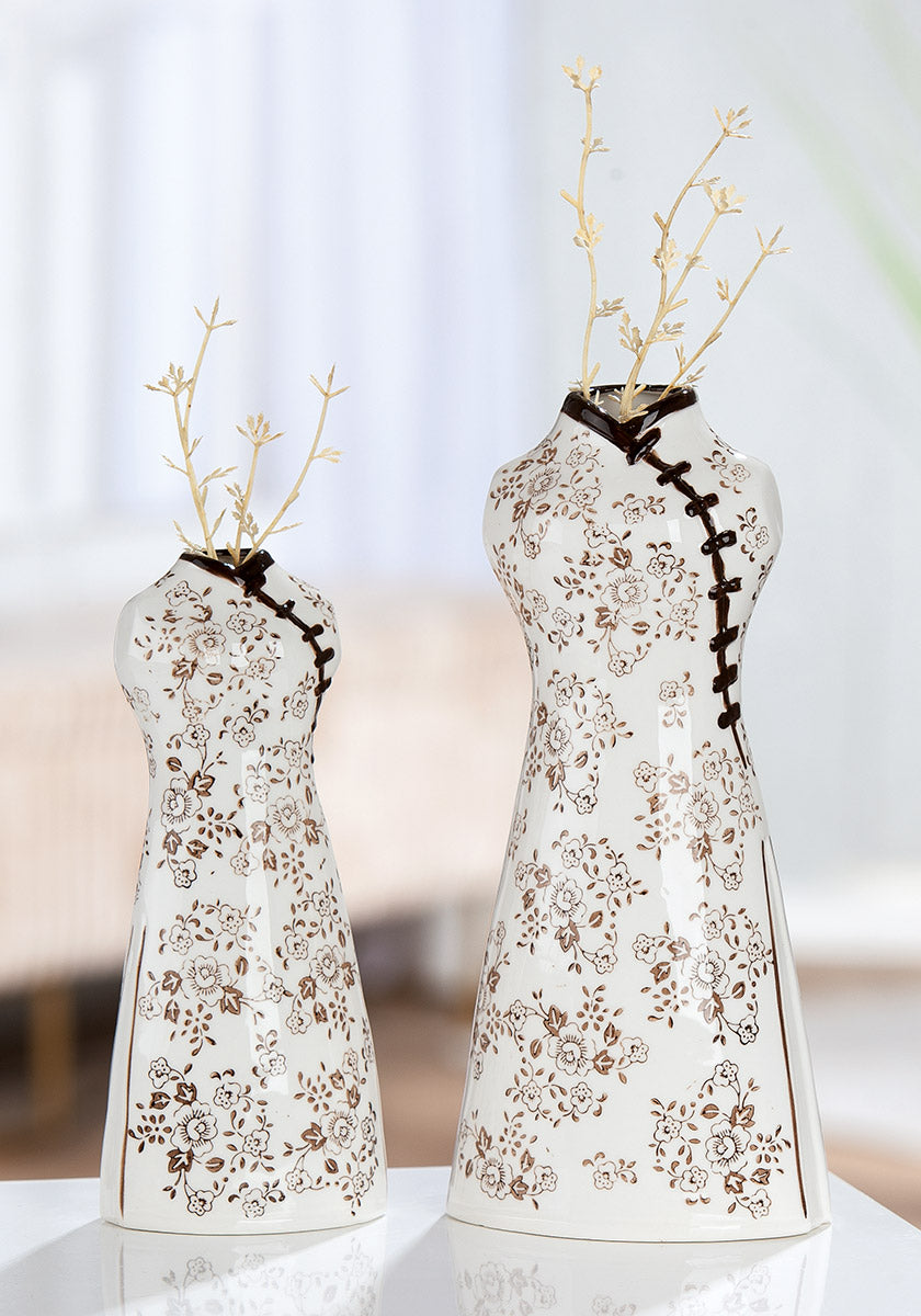 White ceramic Gilde vase with pink Sakura flower motif, 24cm tall, featuring a classic vase shape and floral design.