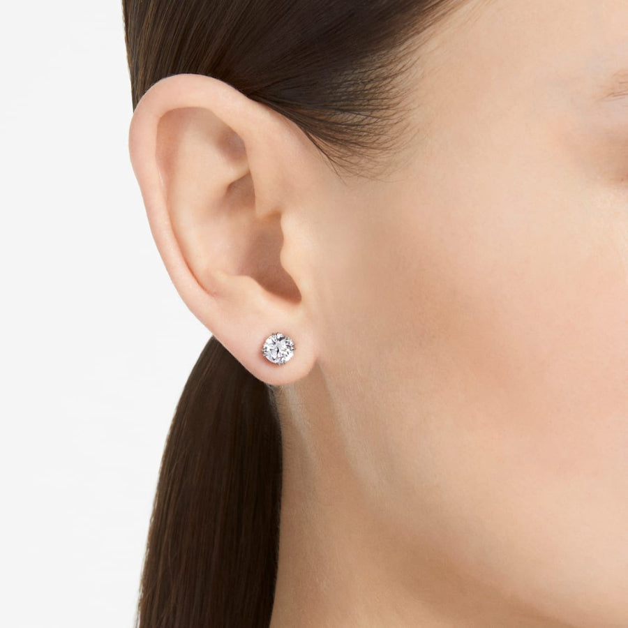 Swarovski Constella round cut stud earrings with sparkling crystal design on a white background