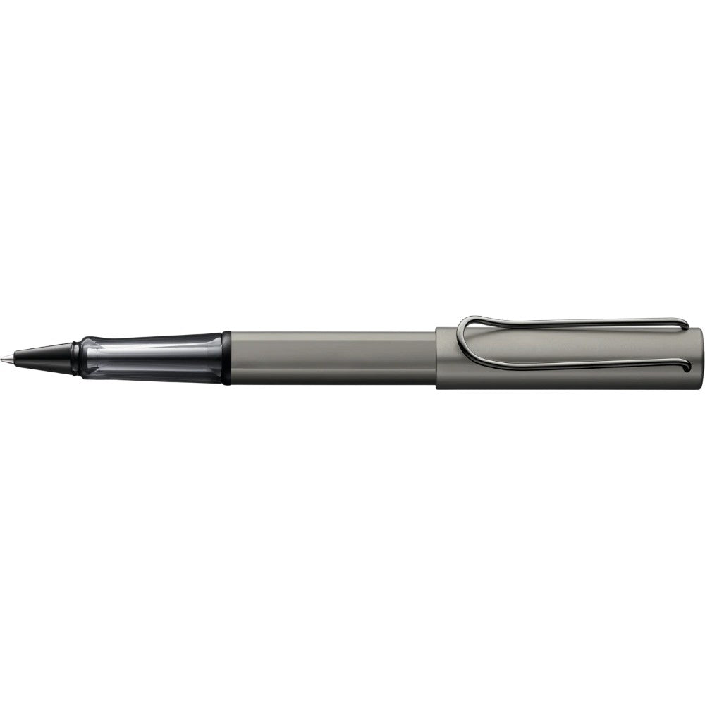 Spilhaus LAMY Lx ballpoint pen with sleek silver body and black grip, shown resting on a white surface.