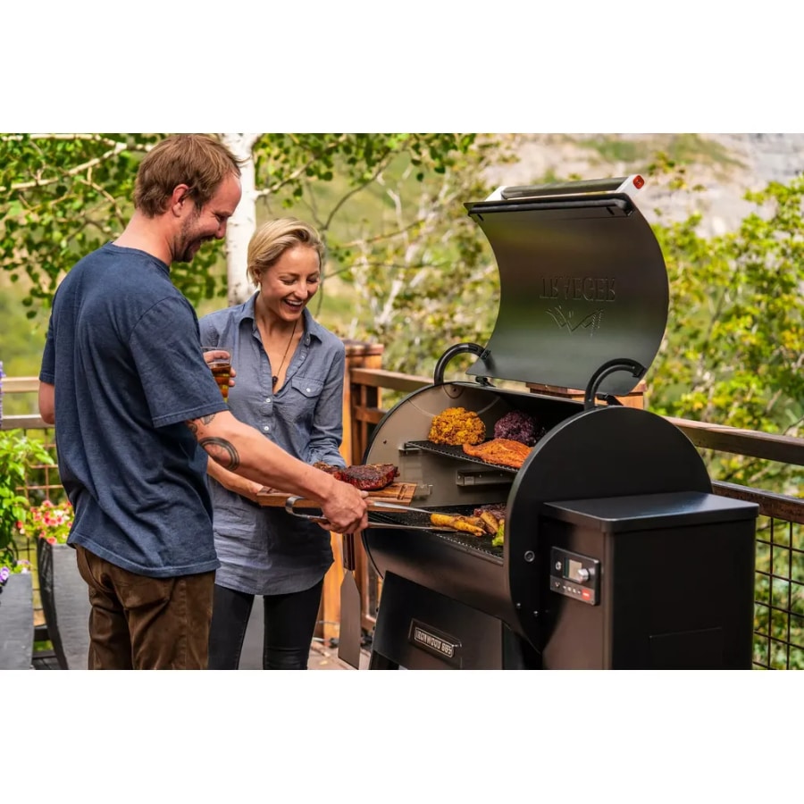 Traeger Ironwood 885 wood pellet grill with digital control panel and stainless steel construction for outdoor cooking.