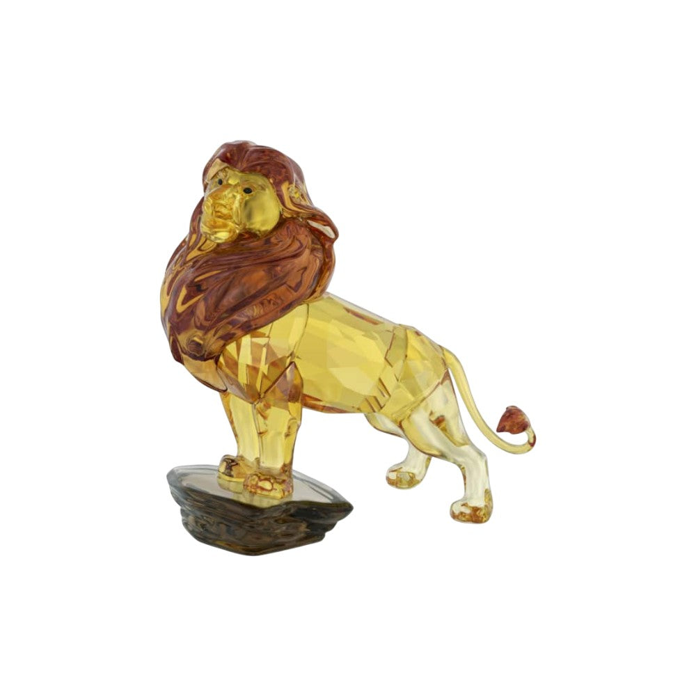 Swarovski Mufasa Lion King crystal figurine with detailed gold accents and sparkling crystal finish, showcasing craftsmanship.