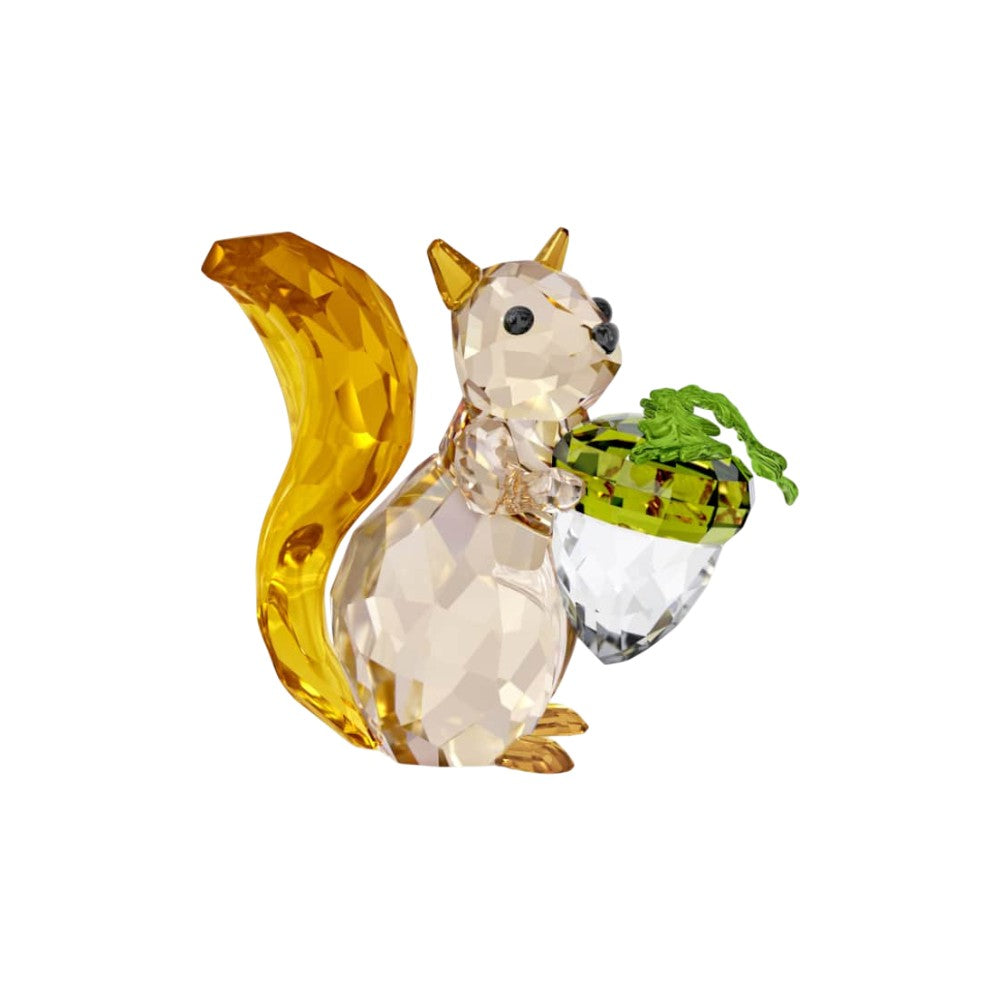 Swarovski Idyllia squirrel figurine with detailed crystal craftsmanship holding an acorn, elegant decorative piece.