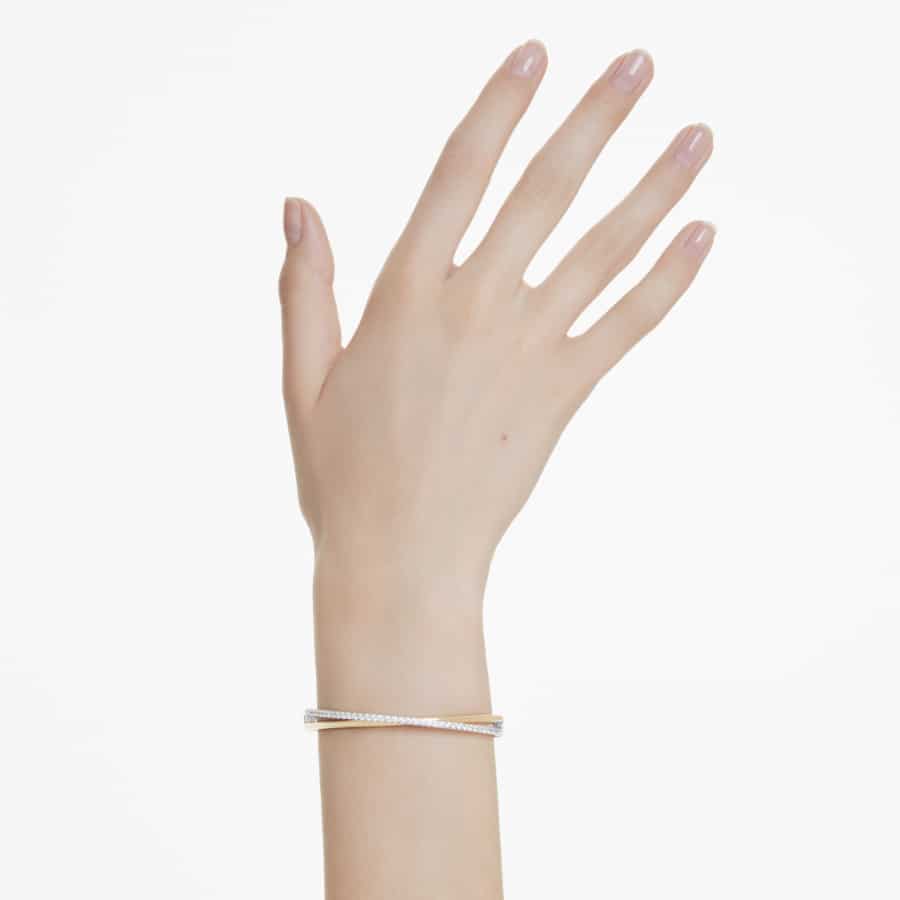 Swarovski Hyperbola Bangle featuring sparkling crystal design and sleek silver-tone finish, stylish jewelry accessory.