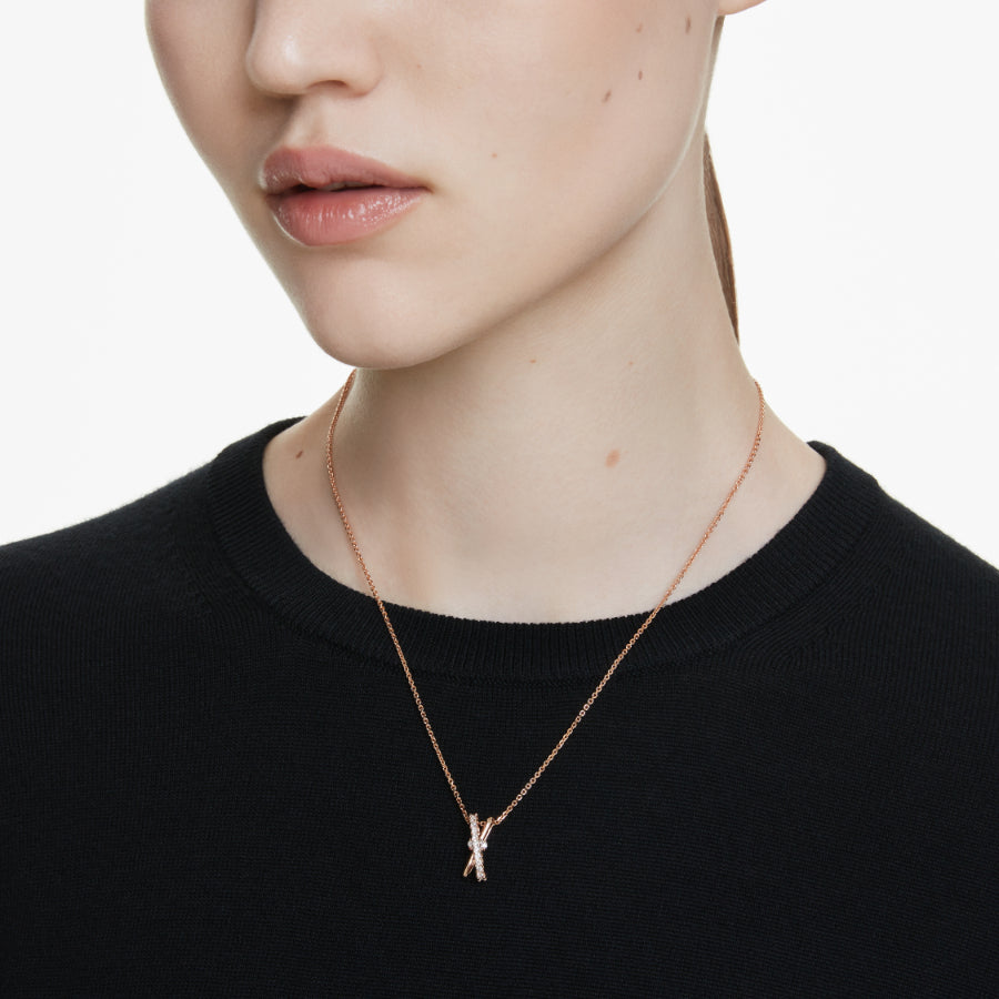 Swarovski Hyperbola pendant with mixed cuts and twist design in white crystal, rose gold-tone plated.