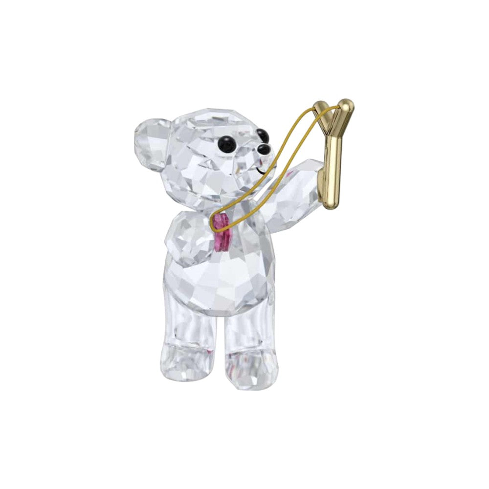 Swarovski Kris Bear Sending You Love figurine with clear crystal bear holding a heart-shaped crystal, detailed craftsmanship.