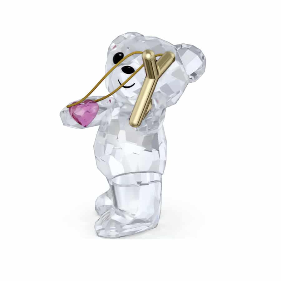 Swarovski Kris Bear Sending You Love crystal figurine with a heart, detailed glass craftsmanship, and sparkling finish.