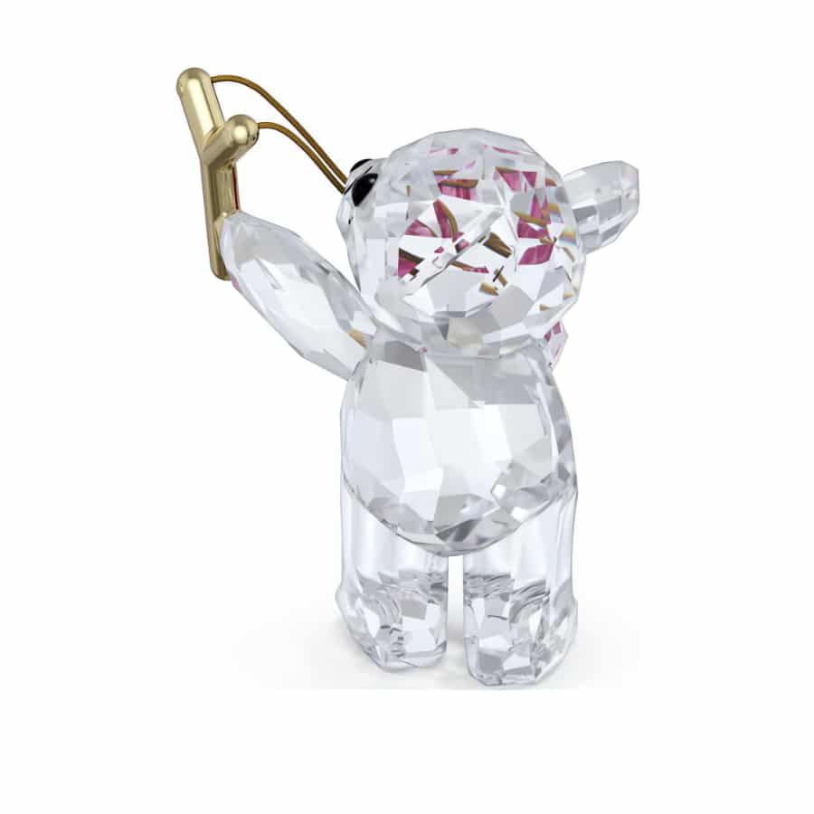 Swarovski Kris Bear Sending You Love crystal figurine with a heart, detailed with sparkling Swarovski crystals and a cute bear design.