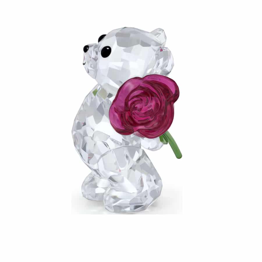 Swarovski Kris Bear figurine holding a rose with a love message, detailed crystal craftsmanship, and sparkling accents.