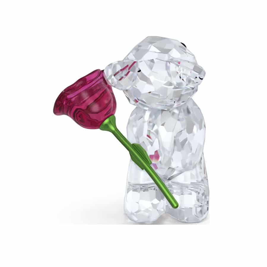 Swarovski Kris Bear A Rose with Love figurine featuring a crystal bear holding a pink rose, detailed and sparkling craftsmanship.