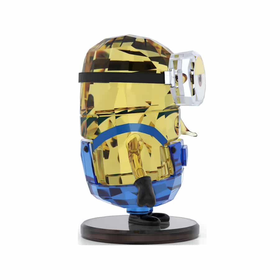Swarovski Minions Stuart crystal figurine with detailed yellow body and blue overalls, showcasing sparkling craftsmanship.