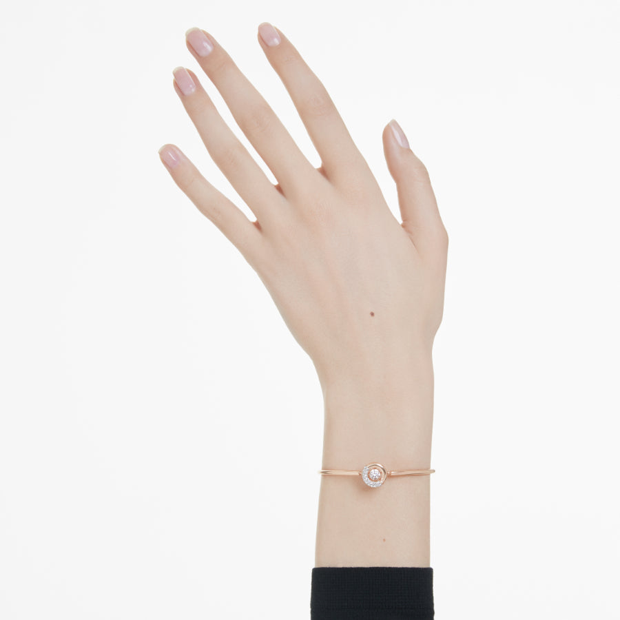 Swarovski Dextera Bangle featuring sparkling crystal accents and a sleek silver-tone design on a white background.