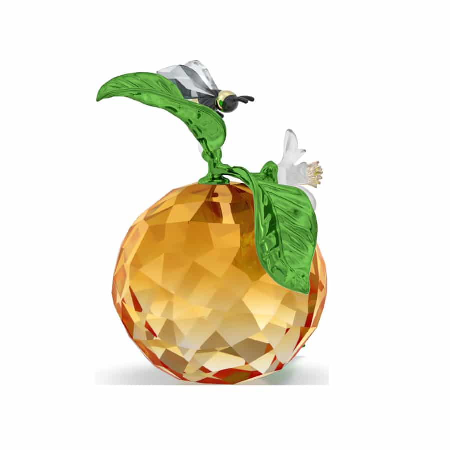Swarovski Idyllia Clementine and Bee figurine featuring a detailed glass bee and vibrant clementine flower design.