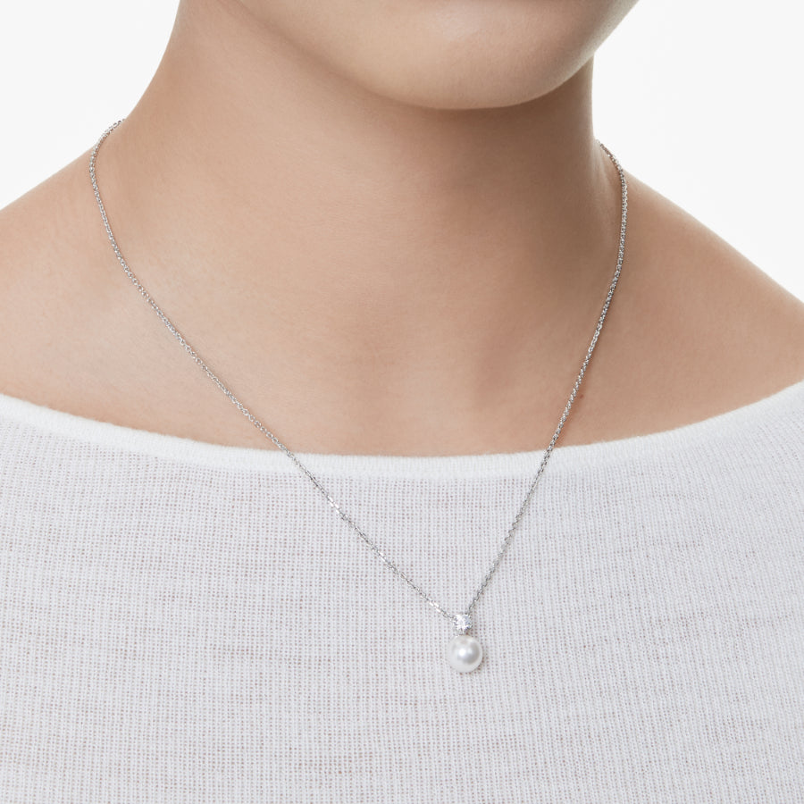 Swarovski Matrix pendant with crystal pearl, round cut white crystal, rhodium-plated jewelry piece on a chain.