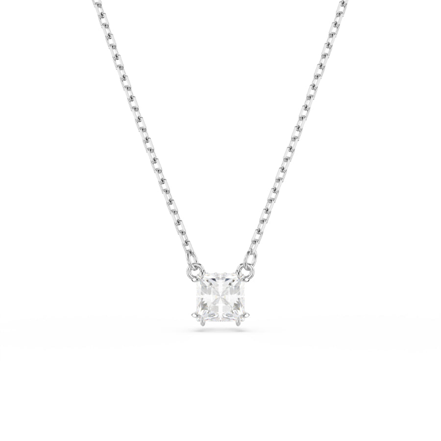 Swarovski Stilla pendant with square white crystal, rhodium-plated setting, showcasing elegant jewelry design.