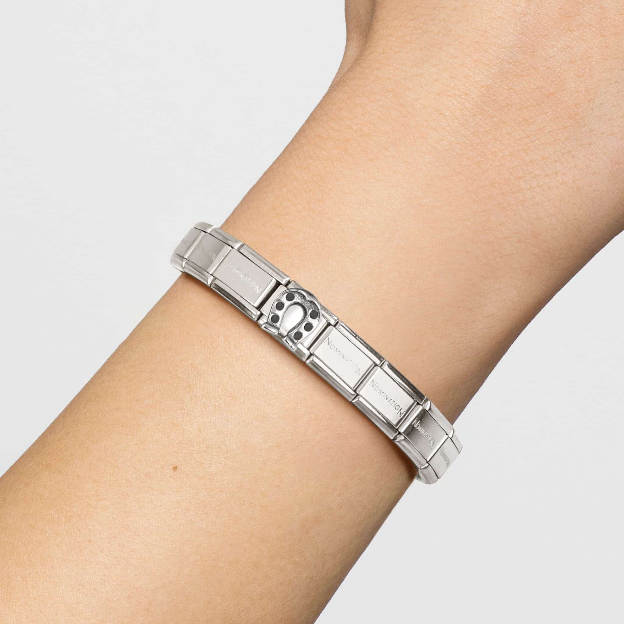 Nomination Horseshoe OX charm in sterling silver and 925 silver with composite design, featuring intricate detailing and a horseshoe shape.