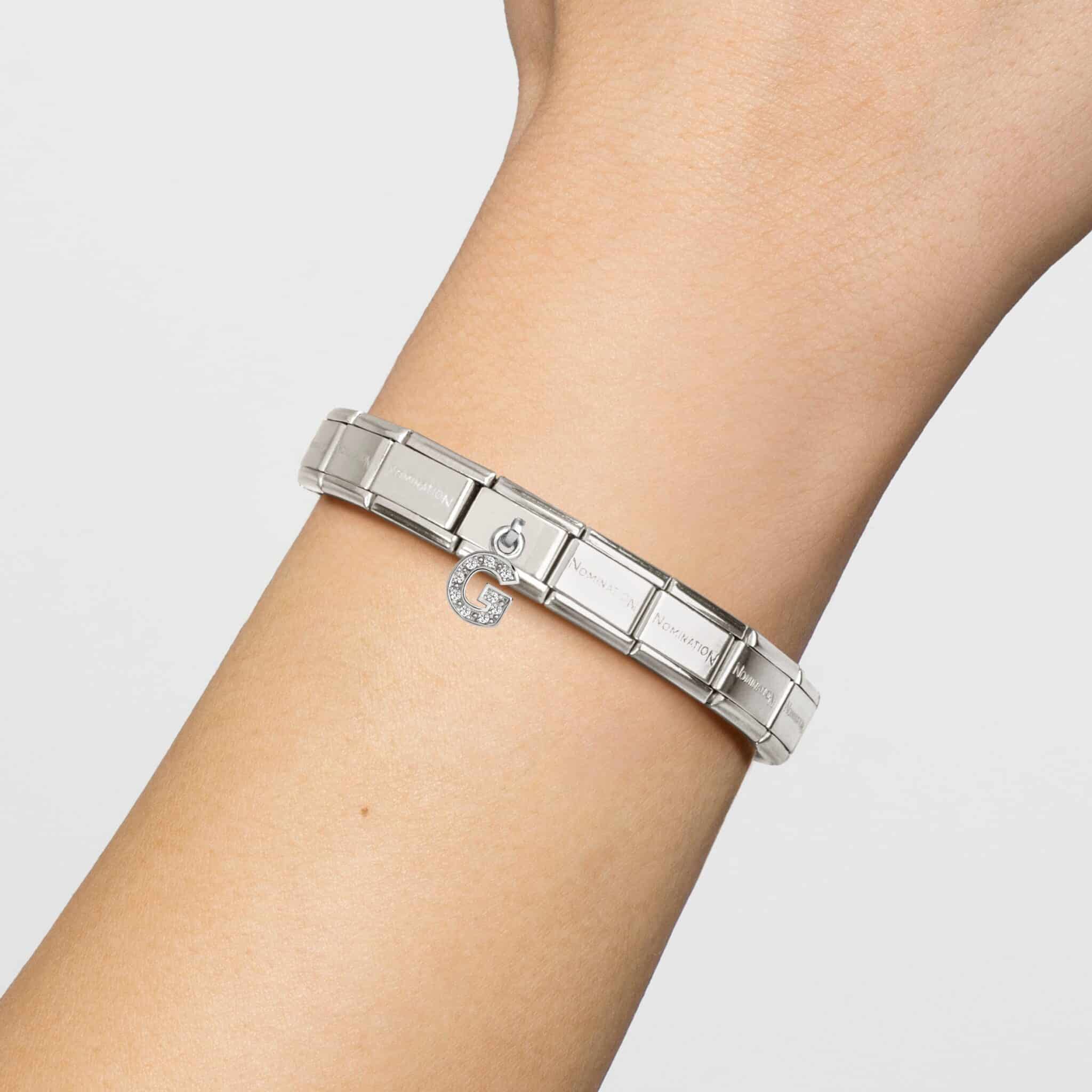 Sparkling Nomination Composable Hanging Link featuring a letter G with rhinestones and polished metal finish.