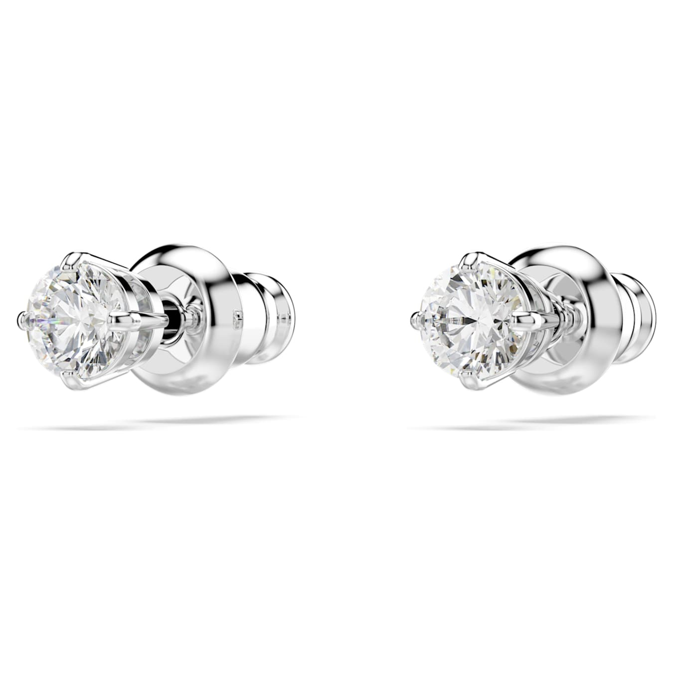 Swarovski Stilla Attract stud earrings with round-cut white crystals and rhodium plating on a white background.