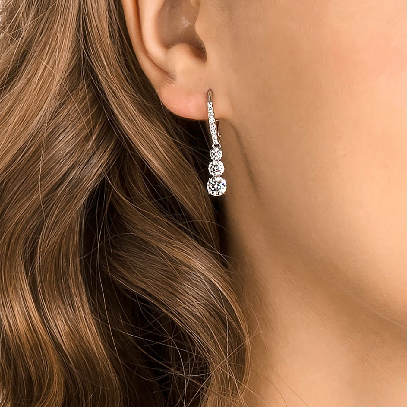 Swarovski Stilla Attract hoop earrings with round white crystals and rhodium plating, stylish jewelry for elegant looks.