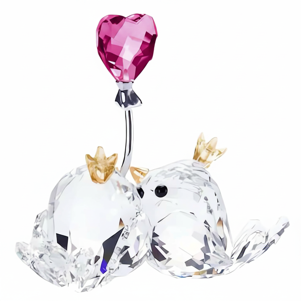 Swarovski Love Birds figurine with pink heart-shaped accents, detailed crystal craftsmanship, and elegant design.