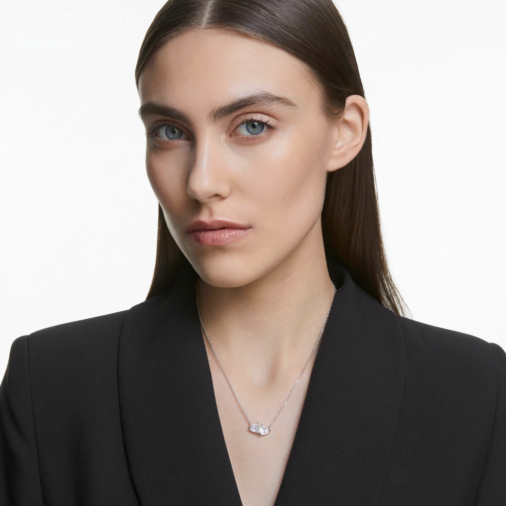 Swarovski Mesmera heart necklace with white crystals and rhodium plating, featuring elegant design and sparkling details.