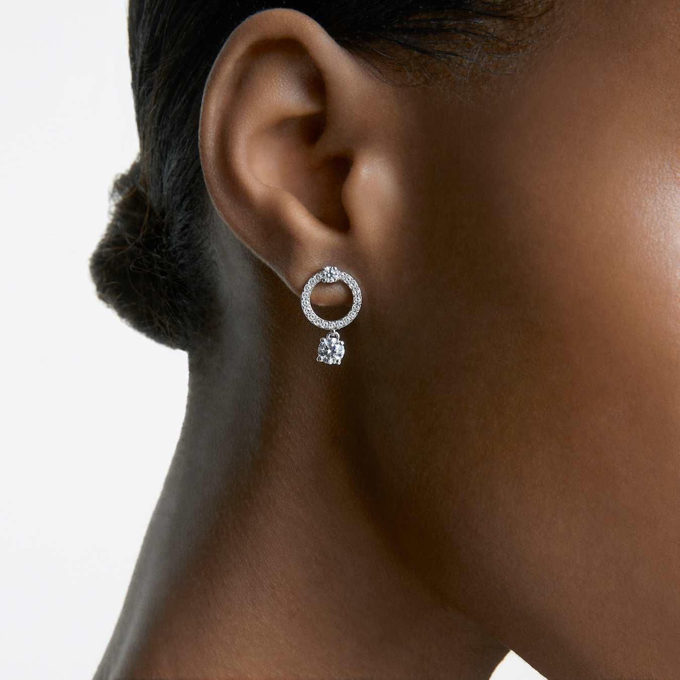 Swarovski Attract hoop earrings with round cut white crystals, rhodium-plated finish, stylish jewelry for elegant looks.