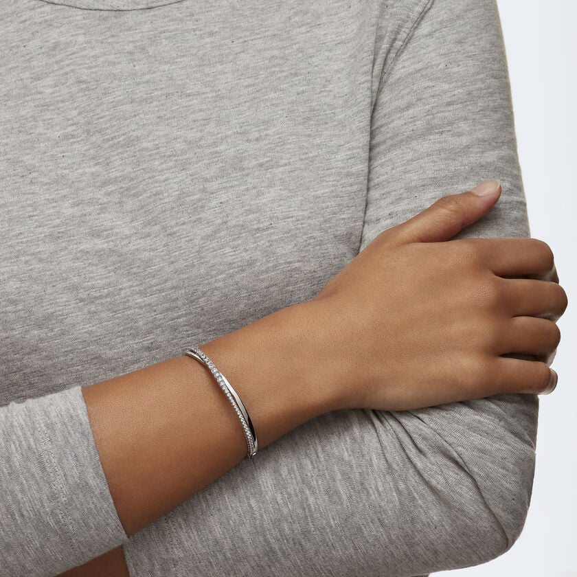 Swarovski Hyperbola Bangle with round-cut white crystals, rhodium-plated silver jewelry, sleek and elegant design