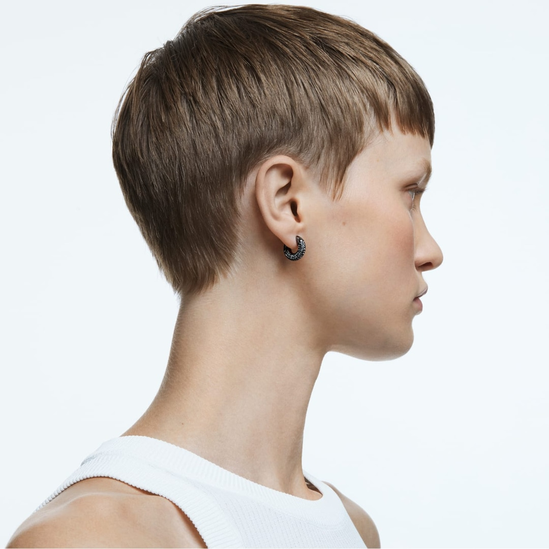Swarovski Dextera small hoop earrings in black ruthenium plating, featuring sleek, minimalist design with smooth finish.