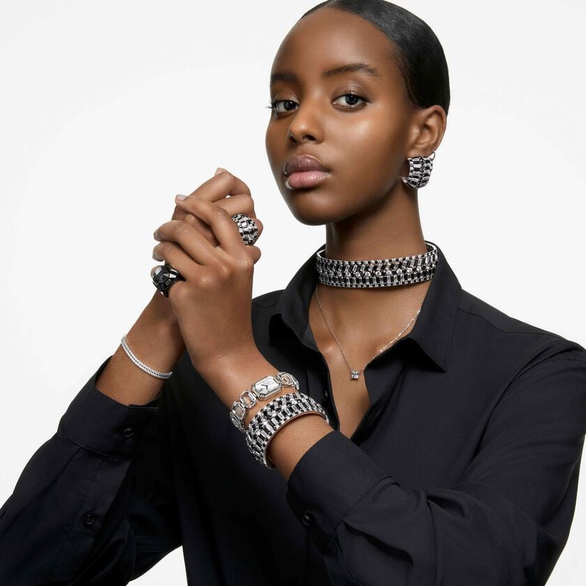 Black Swarovski Hyperbola ring with Swarovski zirconia stones, rhodium plated, featuring a modern, sleek design.