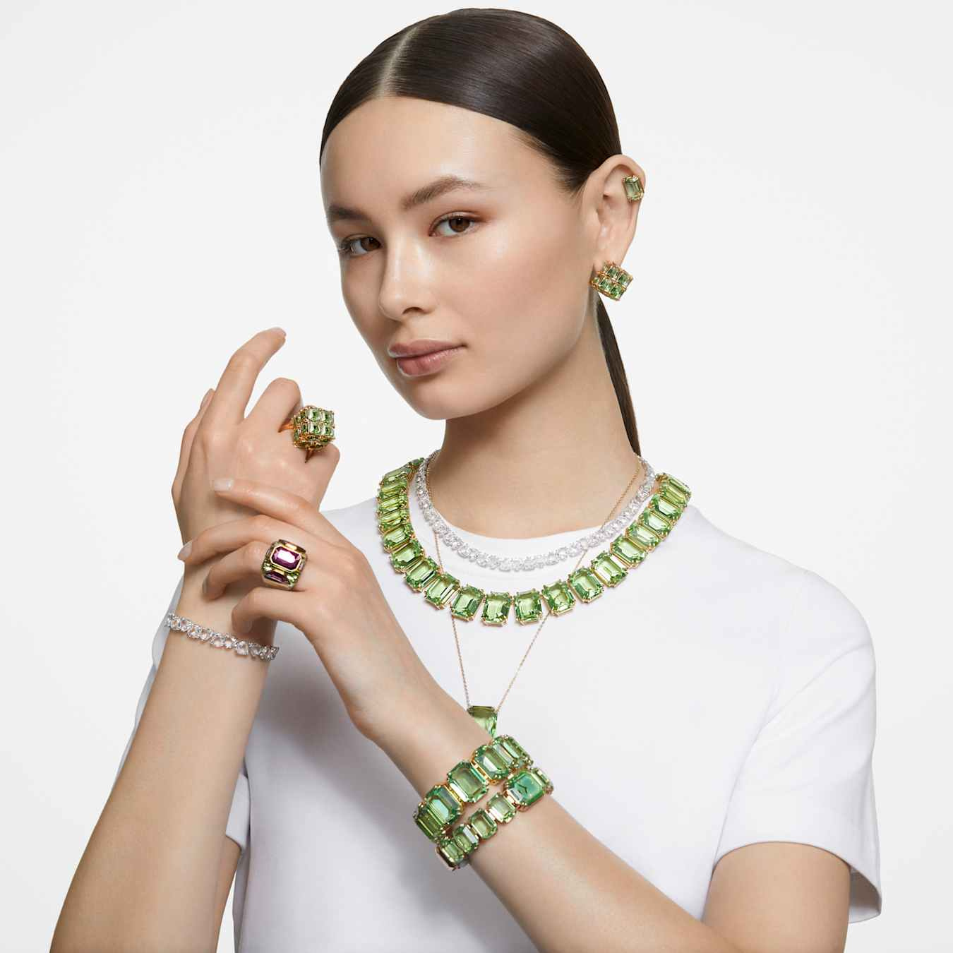 Green square-cut Swarovski Curiosa cocktail ring with gold-tone plating, featuring intricate design and sparkling gemstone accents.