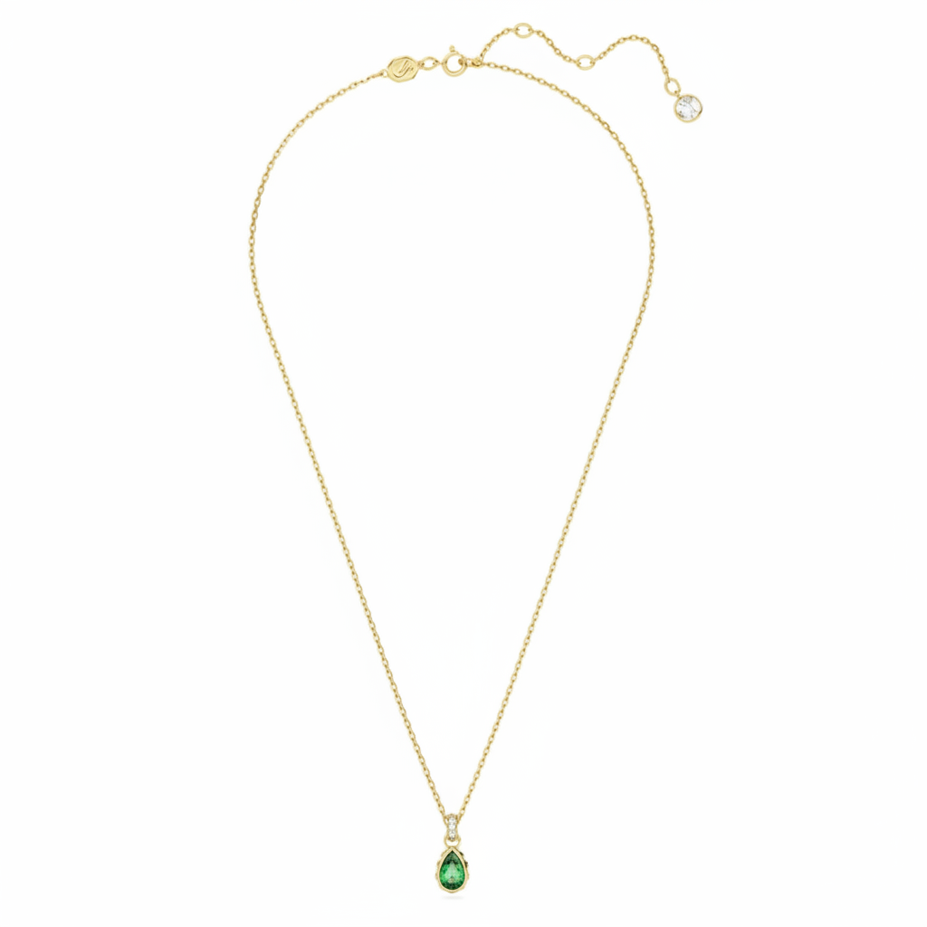 Swarovski Chroma pendant with pear-shaped green crystal, gold-tone plated chain, and sparkling faceted gemstone.