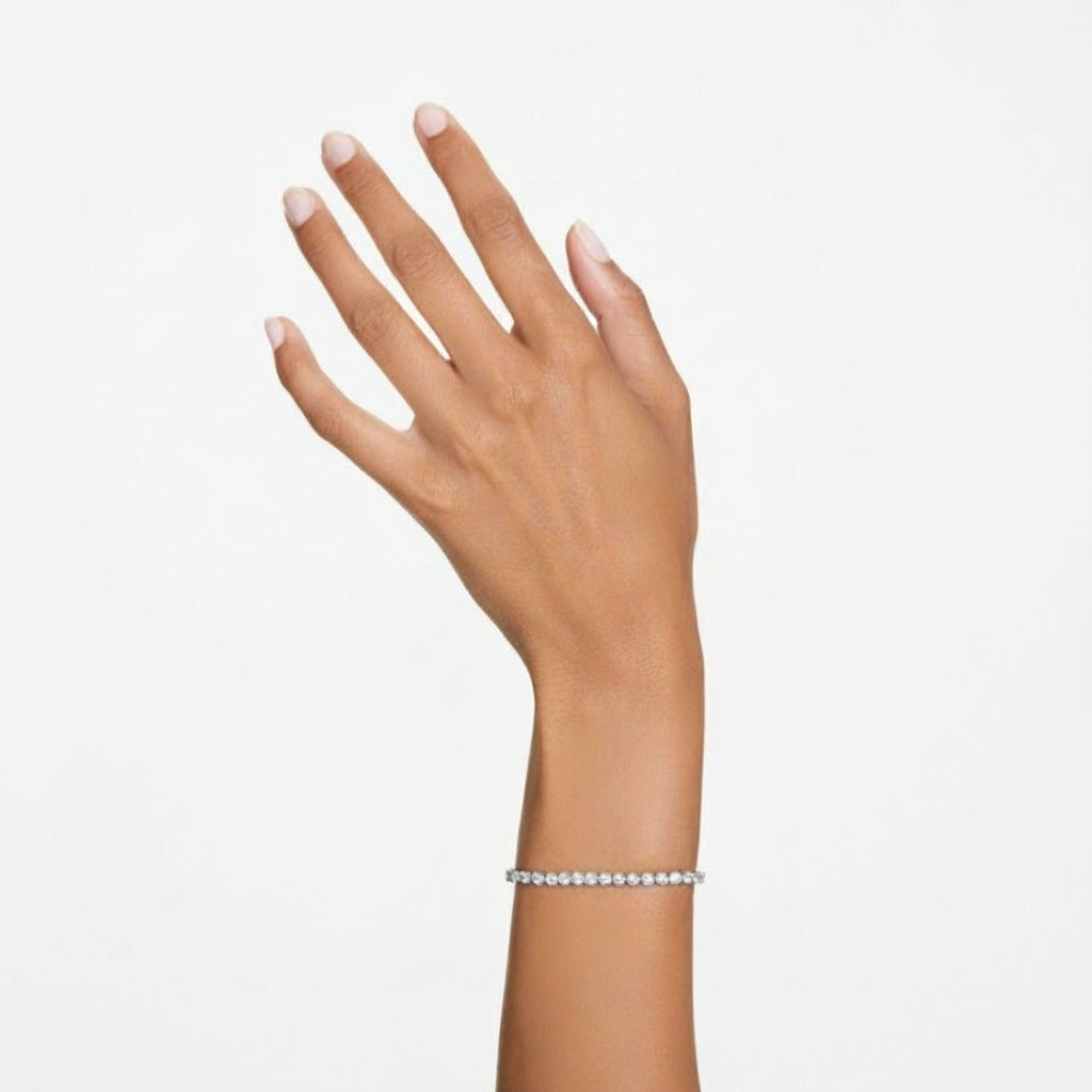 Swarovski Matrix tennis bracelet with round cut white crystals and rhodium plating, showcasing elegant jewelry design.