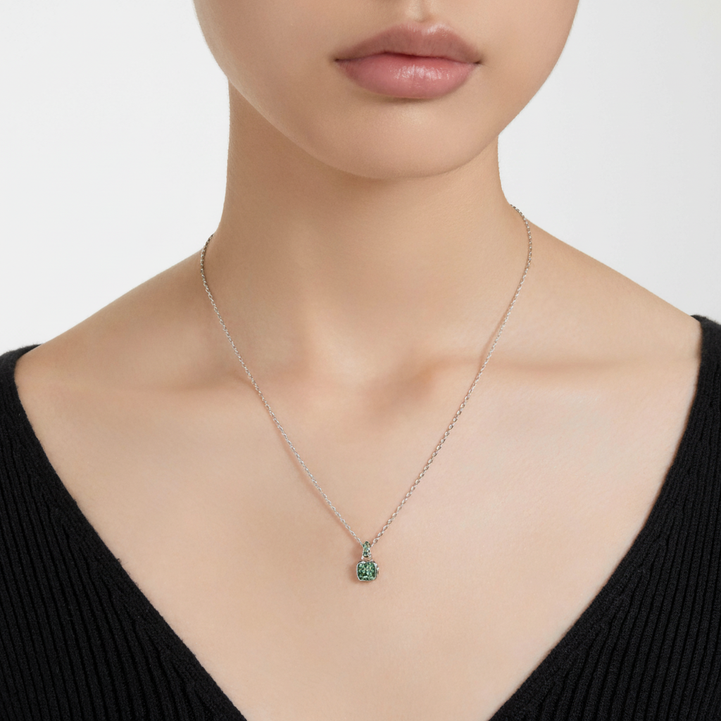 Swarovski May birthstone pendant featuring a square-cut green gemstone, rhodium-plated silver setting, elegant jewelry accessory.