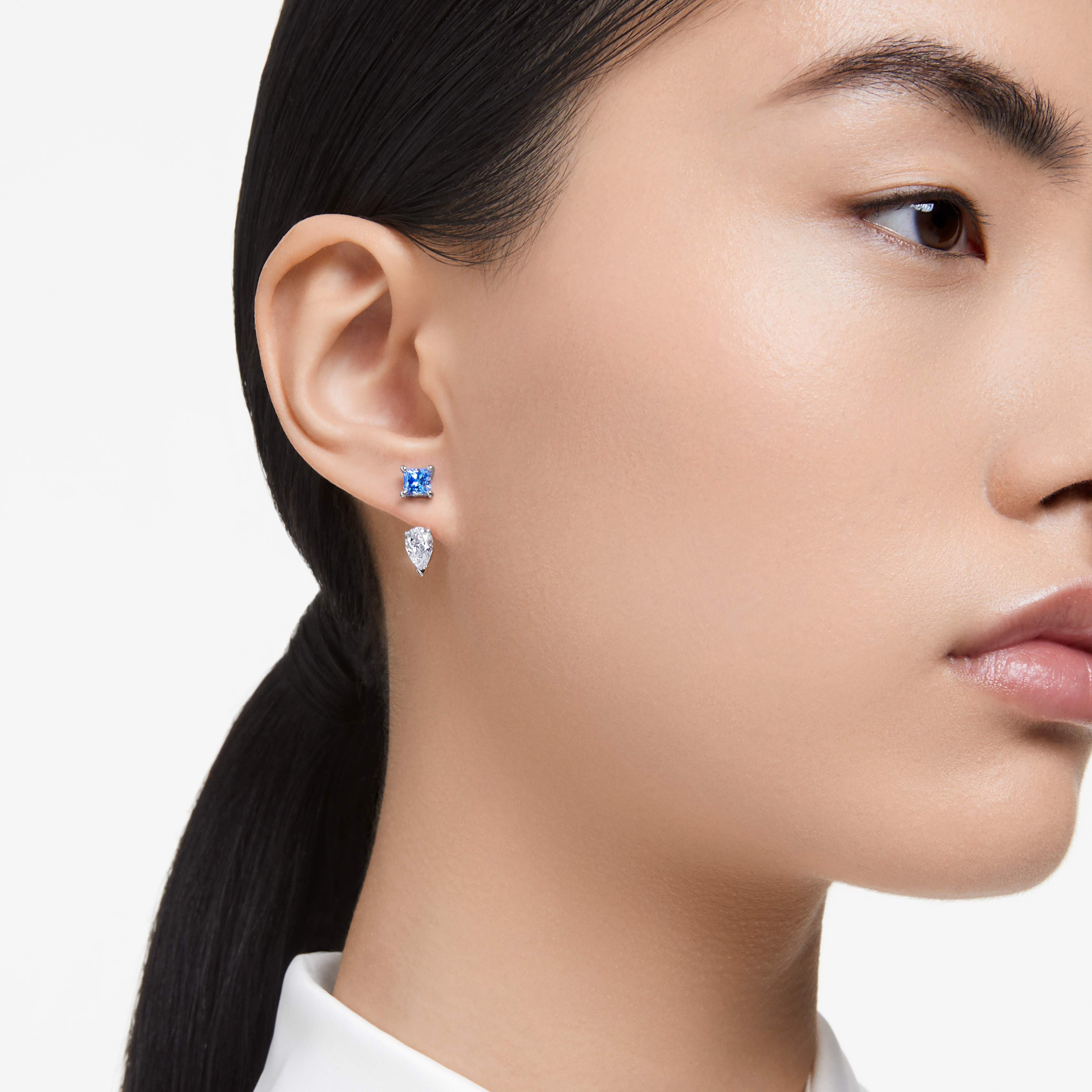 Swarovski Mesmera earring jackets with mixed cuts, detachable blue rhodium-plated jewelry accessory, showcasing intricate design.