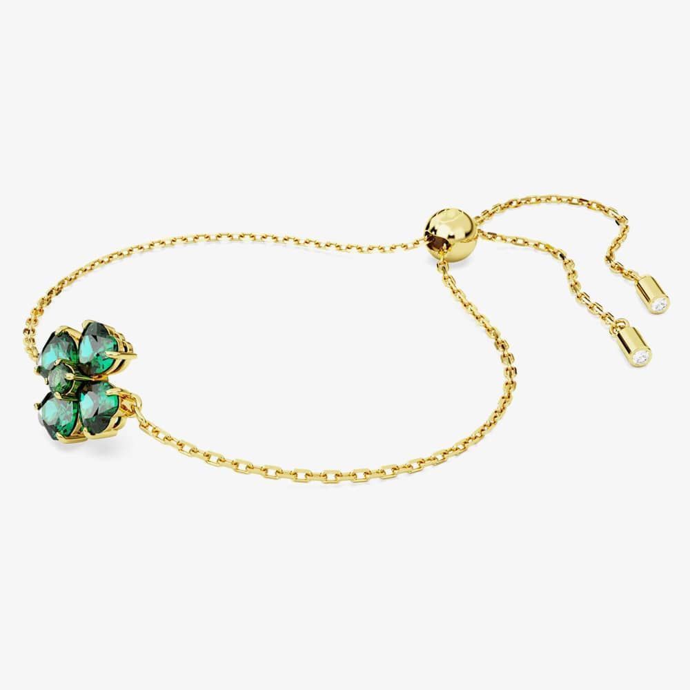 Swarovski Idyllia bracelet with mixed cut green clover-shaped crystals in gold-tone plating, elegant jewelry accessory.