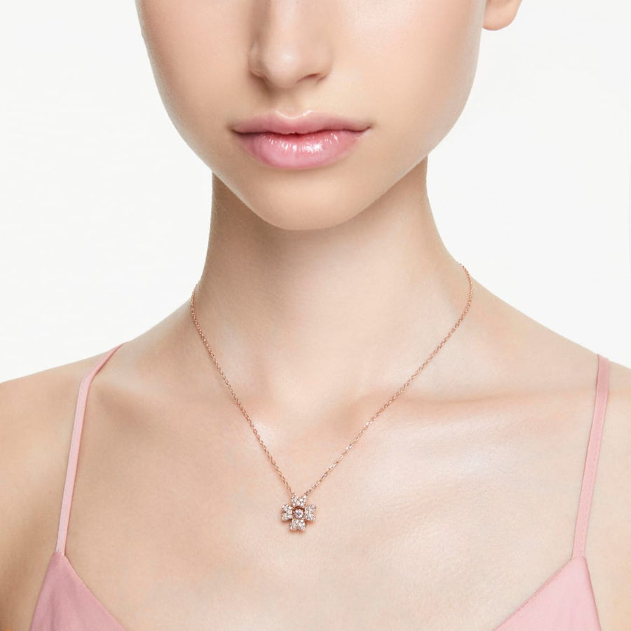 Swarovski Idyllia Clover Pendant in white and rose gold-tone plating, featuring a delicate floral design with sparkling crystals.