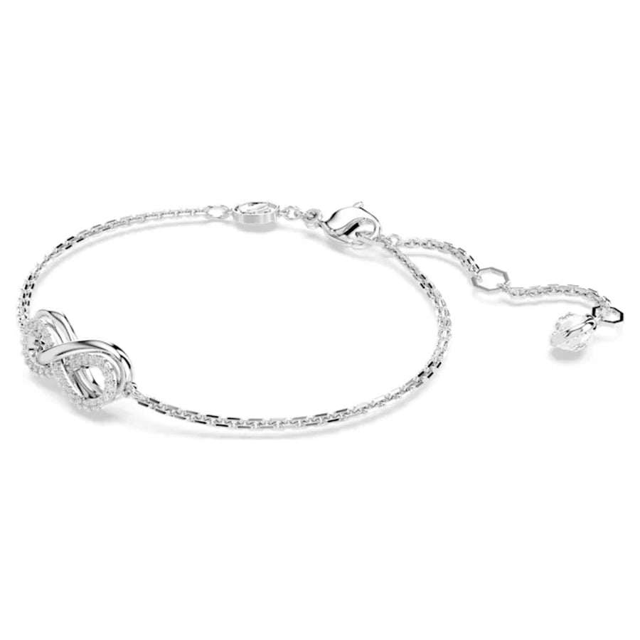 Swarovski Hyperbola bracelet with infinity design, white rhodium plating, featuring sparkling crystals on a sleek jewelry piece.