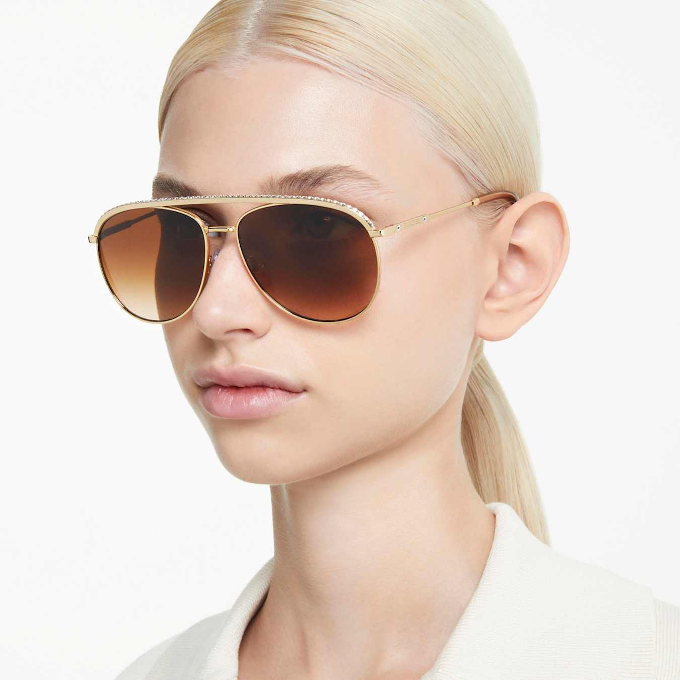 Swarovski Orbita SK7005EL brown sunglasses with sleek frame and tinted lenses, stylish and luxurious eyewear.