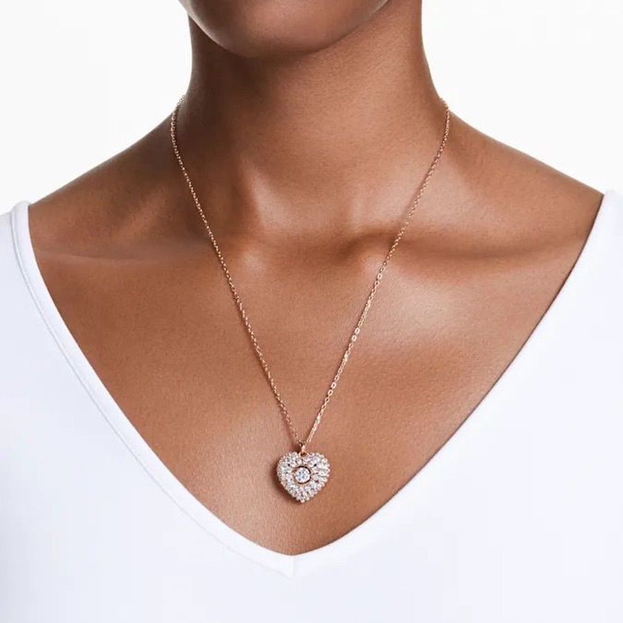 Swarovski Hyperbola Pendant Heart in white with rose gold-tone plating, featuring elegant geometric design and sparkling crystal accents.