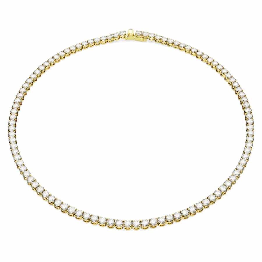 Swarovski Matrix tennis necklace with round-cut white crystals on gold-tone plated chain, elegant jewelry accessory.