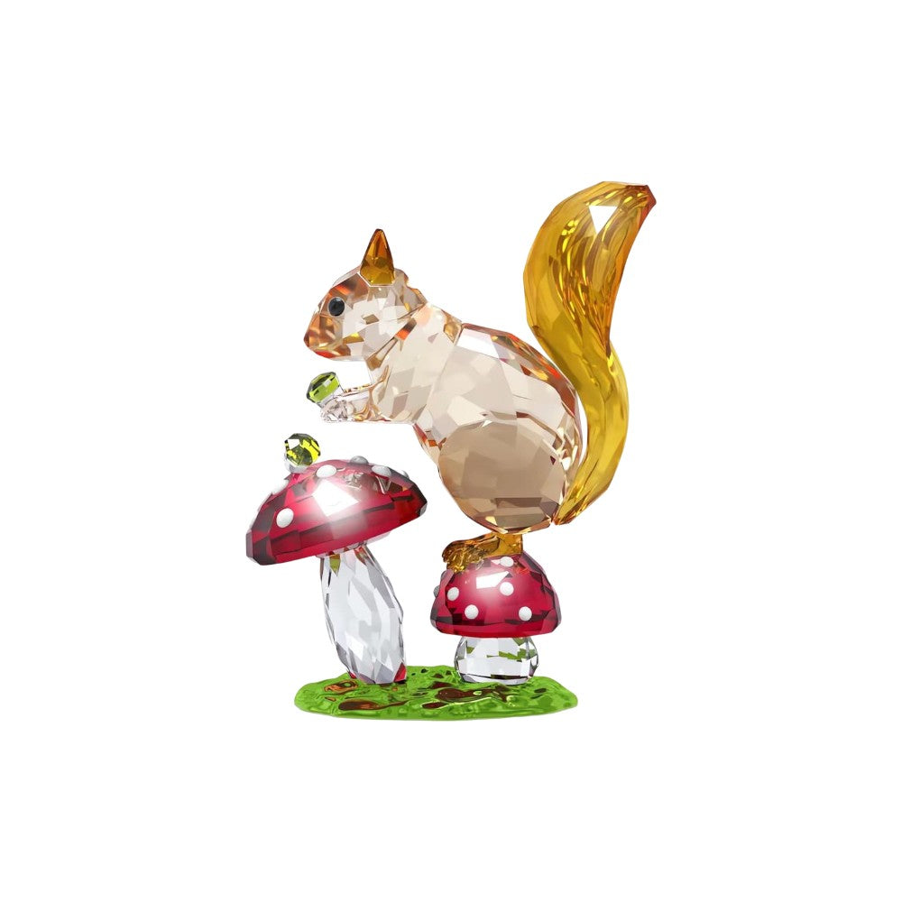 Swarovski Idyllia squirrel figurine with mushrooms, detailed crystal sculpture featuring a cute squirrel among nature elements.