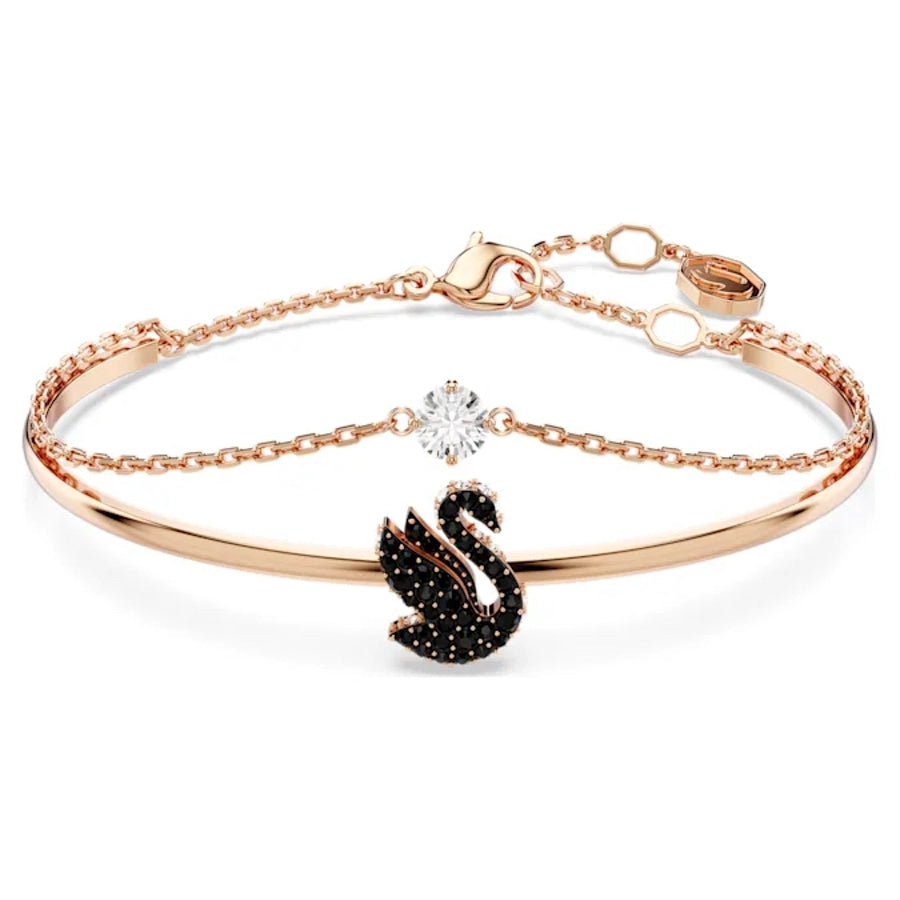 Swarovski black swan figurine with rose gold-tone plated accents, detailed crystal craftsmanship, elegant decorative piece