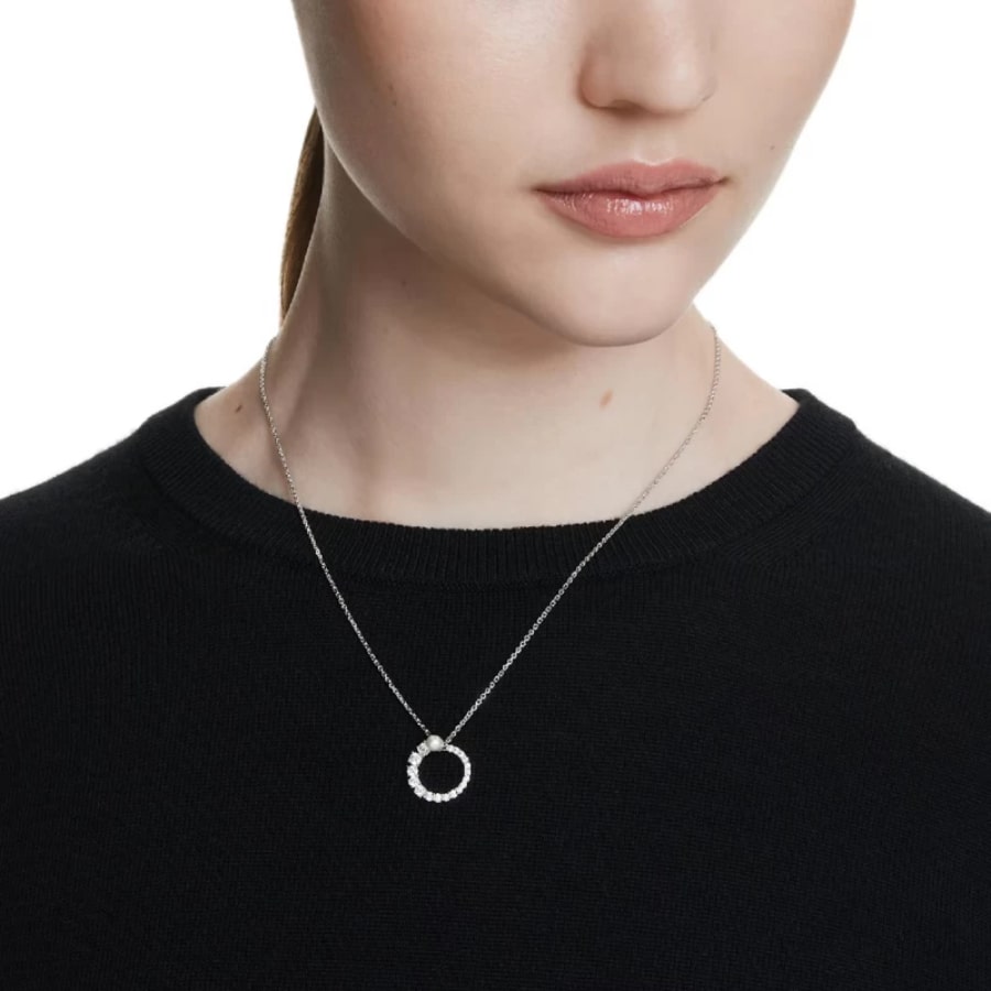 Swarovski Matrix Pendant with white crystal pearl, round cut, rhodium-plated jewelry piece showcasing elegant sparkle and shine.