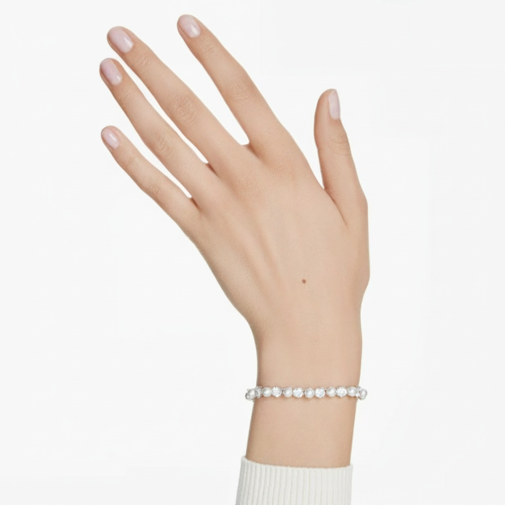 Swarovski Matrix Tennis Bracelet featuring sparkling crystal stones on a sleek silver-tone chain, elegant jewelry accessory.